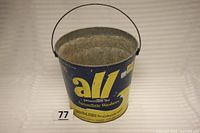 Front view of the vintage Monsanto All laundry detergent bucket with handle, showing logo and text.