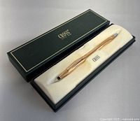 Full view of the Cross ballpoint pen in original box showing pen and box interior.