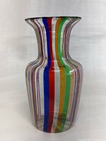 Front view of clear glass vase with rainbow stripes and flared rim