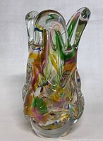 Front view of the multicolor hand blown glass vase showing organic clear glass with internal colors.