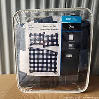 Packaged Mainstays twin comforter set with visual of product and included pieces.