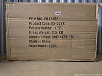 Cardboard box with product details showing SKU, size, weight, and origin revealing packaging condition and item info