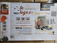 Box front showing MidWest Homes for Pets Life Stage single door dog crate labeling, including product images and features.
