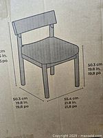 Diagram on the packaging showing dimensions of a Flexsteel utility dining chair including height and width in centimeters and inches.