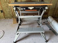 Front view of the Black & Decker Workmate 550 portable workbench showing steel frame with folding legs and MDF top with minor wear.