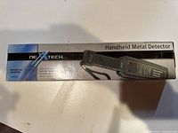 Photo of original NexTech handheld metal detector box showing model and features