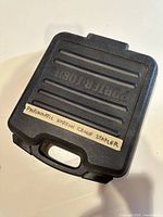 Closed black hard plastic carrying case with 'PORTER-CABLE' embossed on the top and label 'Pneumatic Narrow Crown Stapler'.