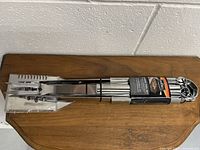 Full set of 9 pieces bundled together including spatula, fork, tongs, and 6 skewers.