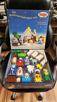 Complete deluxe Haba nativity wooden set in original box showing all figures and stable components.