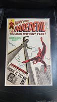 Front cover of Daredevil #8 comic book showing Daredevil and Stilt Man on a cityscape background.