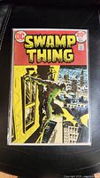 Full front cover view of Swamp Thing Comic Book #7 showing main artwork, title, price, and issue number.
