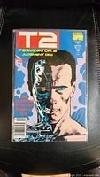 Front cover of Terminator 2 Judgment Day comic book showing full cover artwork including T2 logo and half cyborg face