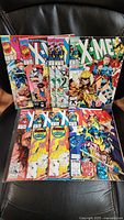 Lot of nine vintage X-Men Vol 2 comic books laid out showing vibrant comic cover art with multiple characters.
