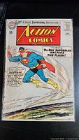 Front cover image showing Superman flying with the Action Comics title and DC logo, priced at 12 cents from July 1964 issue.