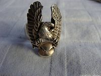 Front view of the sterling silver eagle ring showing the detailed eagle with wings raised and spread, finely textured feathers visible.