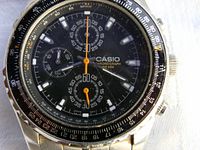 Close-up of the black dial with chronograph subdials, tachymeter bezel, and Casio branding.