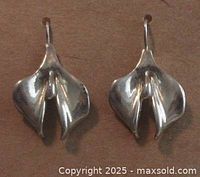 Front view of both sterling silver flower earrings showing petal details.