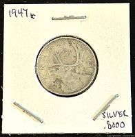 Reverse side of 1947 Canadian 25 cent silver coin with leaf design and denomination, mounted on card.