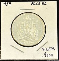Reverse of 1959 Canadian 50 cent coin showing Canadian coat of arms and 80% silver indication