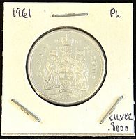 Obverse side of 1961 Canadian 50 cent coin with Canadian Coat of Arms and 80% silver marking