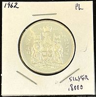 Reverse side of the 1962 Canadian 50 cents silver coin showing the Canadian coat of arms.