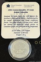Photo of certificate with detailed description and specifications of the coin including metal composition, designer, diameter, weight.