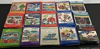Photo of 15 Mattel Intellivision video game boxes arranged in rows.