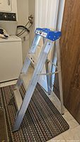 Side view of the aluminum step ladder showing steps and side support