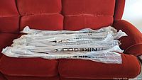 All eight shafts still sealed in original plastic with visible NikeGolf text