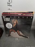 Photo showing front of vinyl record stack led by Tina Turner album