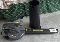 Full view of the black Yardworks electric leaf blower vac showing the handheld unit and long nozzle.
