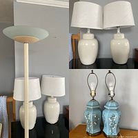 Photo showing tall floor lamp with frosted glass shade, two white ceramic ginger jar lamps with shades, and two blue ceramic hexagonal lamps without shades