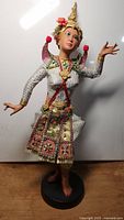 Front view of the Japanese ceremonial dancing woman doll showing costume details, facial features and pose.