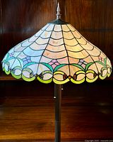 Full view of the lamp shade showing stained glass pattern and colors