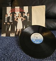 Blondie Parallel Lines album cover with vinyl record showing front side and label.