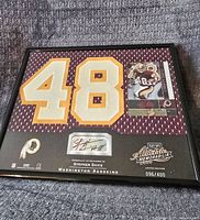 Framed jersey patch with large number 48, Stephen Davis football card and autograph