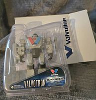 Front view of Valvoline branded packaging containing the Valvotron robot figure, sealed and new.