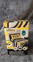 Photo of boxed 3 piece Minions twin sheet set showing packaging and Minions design