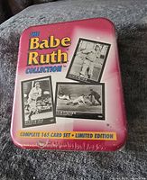 Front view of sealed metal tin for Babe Ruth Collection 165 card set, showing the product name and photos of Babe Ruth.