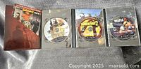 Photo showing all three PS3 game cases open to display discs of Borderlands 2, Mafia 2 and Special Ops The Line.