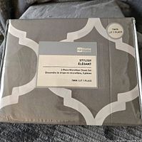 Photo of the packaged sheet set showing label and pattern.