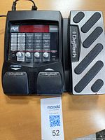 Top view showing the DigiTech RP255 device with dual footswitches and digital display.