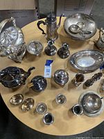 Overhead shot of all silver pieces on round table