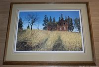 Full view of the framed limited edition print showing the detailed rural farmhouse scene with dry grass and trees under a blue sky.