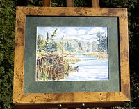 Frontal view of the original watercolor landscape painting, showing signed artwork and burl wood frame with green acid-free matting.