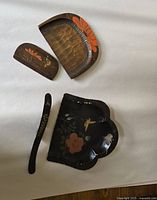 Photo showing two Victorian style wood crumb trays and two small matching brushes with hand-painted toleware floral and bird designs, measuring roughly 6 and 7 inches.