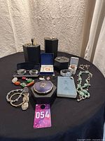 Overview of all items arranged on black tablecloth