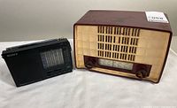 1954 Philips P143 vintage tube radio showing front profile and side by side with Sony ICF-7601 portable radio