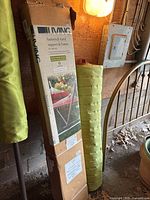 Boxed Living brand metal hammock stand with product label and image of hammock