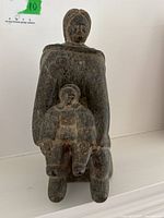 Front view of full sculpture showing mother and child figures